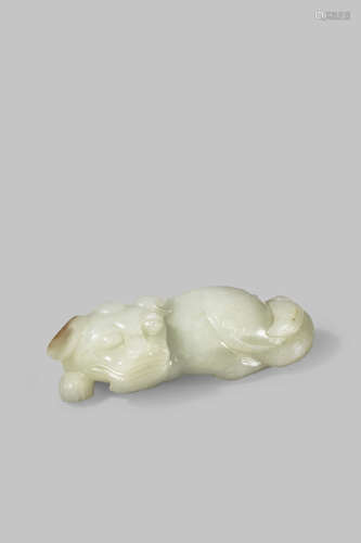 A CHINESE PALE CELADON JADE LION DOG