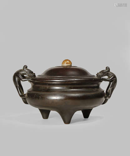 A CHINESE BRONZE TRIPOD INCENSE BURNER