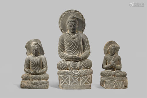 THREE GANDHARAN GREY SCHIST FIGURES OF BUDDHA