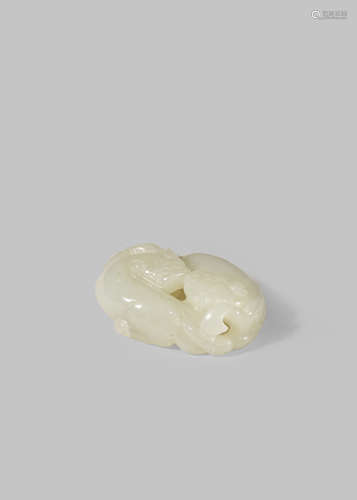 A CHINESE PALE CELADON JADE CARVING OF TWO LION DOGS