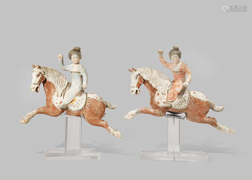 TWO CHINESE POTTERY FIGURES OF POLO PLAYERS