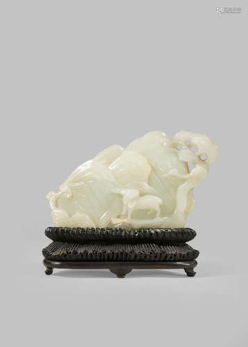 A CHINESE PALE CELADON JADE CARVING OF A MOUNTAIN