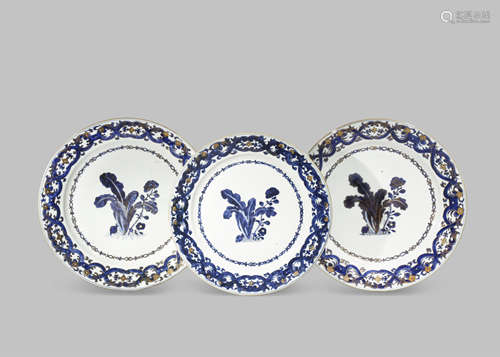 THREE LARGE CHINESE BLUE AND WHITE BOTANICAL PLATES AFTER A DESIGN BY MARIA SYBILLE MERIAN