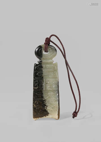 A CHINESE BLACK AND CELADON JADE 'COIN' PENDANT