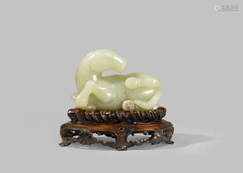 A CHINESE YELLOW JADE CARVING OF A HORSE