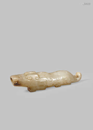 A CHINESE GREY JADE ARCHAISTIC CARVING OF A MYTHICAL BEAST