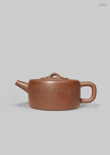 A CHINESE INSCRIBED YIXING TEAPOT AND COVER