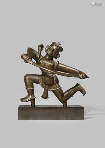 AN EAST INDIAN BRONZE FIGURE OF KALA