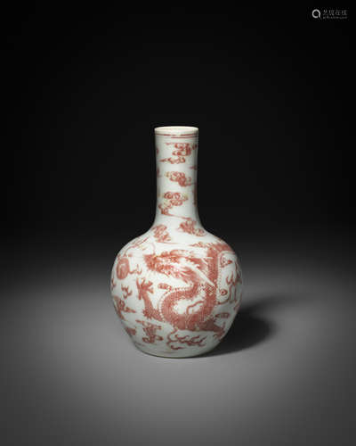 A RARE CHINESE UNDERGLAZE COPPER-RED 'DRAGON' BOTTLE VASE