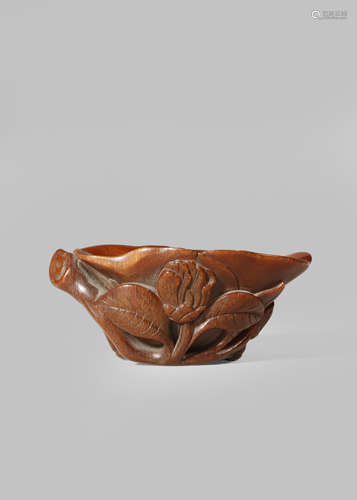 A CHINESE RHINOCEROS HORN 'MAGNOLIA' LIBATION CUP