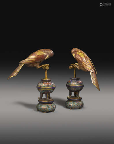 A RARE PAIR OF CHINESE CLOISONNE MODELS OF BIRDS ON STANDS