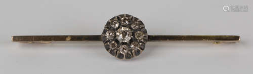 A gold, silver and diamond nine stone cluster bar brooch, claw set with the principal cushion shaped