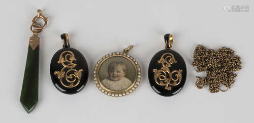 A gold mounted and seed pearl circular pendant locket by Merle Bennett & Co, detailed '9ct', with