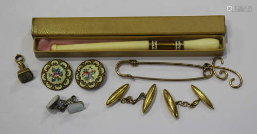 A pair of gold torpedo shaped cufflinks, two mother-of-pearl buttons, an early 20th century French