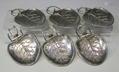 A set of six Edwardian silver side dishes, each in the form of a leaf with loop handle and hinged