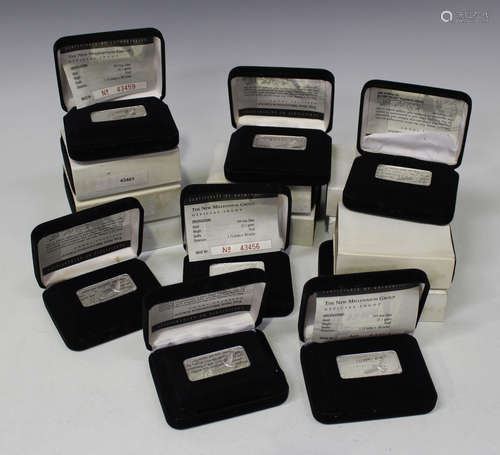 A collection of sixteen 'The New Millennium Group' silver ingots, each cased separately.Buyer’s