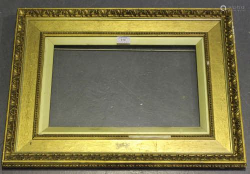 A late 19th/early 20th century gilt wood and gesso composition Watts style frame with gilt inslip,