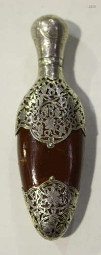 A late 19th century Continental silver mounted nut scent bottle, the hinged lid with engraved