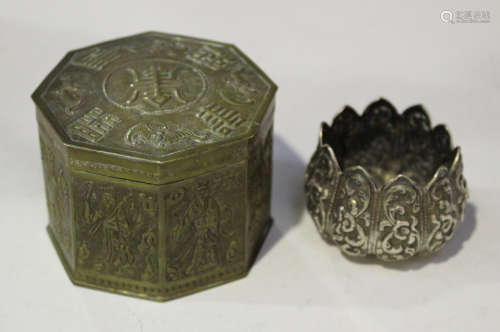 A Chinese plated octagonal box and cover, the top decorated in relief with bats and characters,