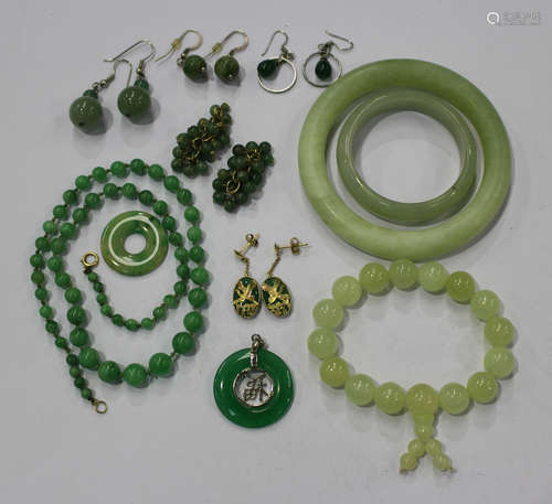 A single row necklace of fifty-nine graduated jade beads on a gold boltring clasp, length 45.5cm,