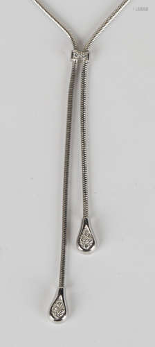 A white gold and diamond set pendant necklace, the front with two graduated drops, each mounted with