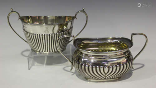 A late Victorian silver two-handled sugar bowl of half-reeded oval form, Sheffield 1895 by