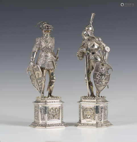 A pair of early 20th century German sterling silver and parcel gilt models of medieval knights, each