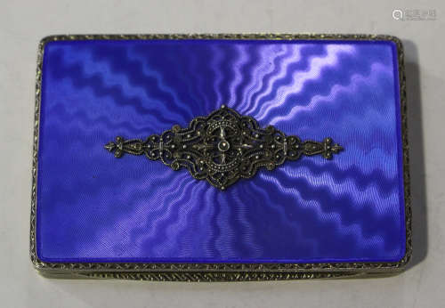 A George V silver and blue enamelled rectangular snuff box, the hinged lid decorated with a
