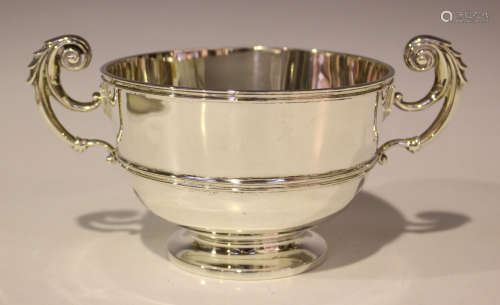 An Edwardian silver trophy cup with acanthus leaf capped scroll handles, London 1903 by Johnson,