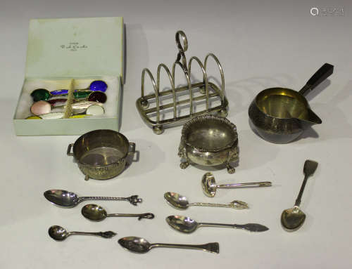 A George V silver four-division toast rack with loop handle and ball feet, Sheffield 1924 by