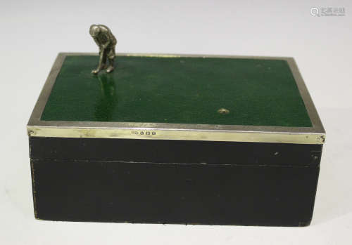A George V silver mounted rectangular ebonized wood and green stained leather cigarette box, the