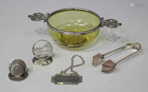 A late Victorian silver mounted amber tinted glass bowl of quaich form, the spiral moulded bowl