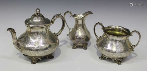 A Victorian silver three-piece tea set, comprising teapot, milk jug and two-handled sugar bowl, each