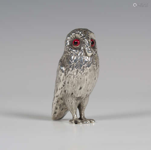 A Victorian silver novelty pepper castor in the form of an owl with glass eyes and detachable