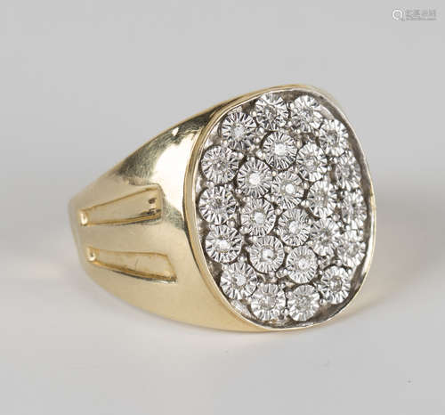 A gold and diamond set oval ring, mounted with circular cut diamonds, detailed '14K', ring size