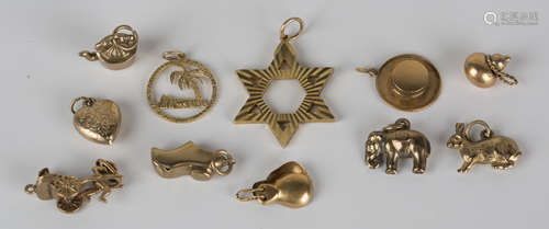 A group of mostly 9ct gold jewellery, comprising a Star of David pendant, ten charms, including an