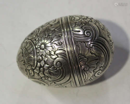A George III silver nutmeg grater of ovoid form, the screw lid revealing a steel grater, the