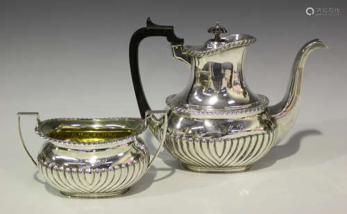 A late Victorian silver coffee pot and matching sugar bowl, each with half-reeded decoration,