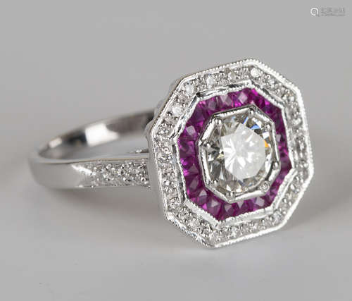 An 18ct white gold, diamond and ruby octagonal cluster ring, mounted with the principal circular cut