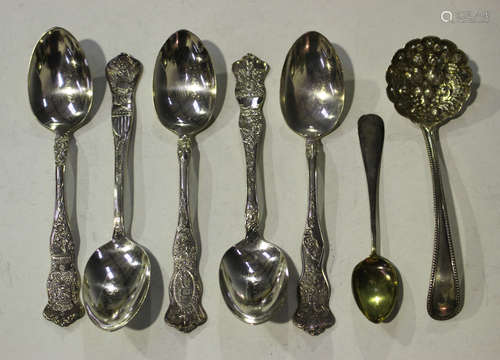 A set of five American silver souvenir spoons, each handle decorated with a different country