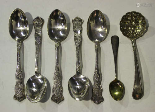 A set of five American silver souvenir spoons, each handle decorated with a different country