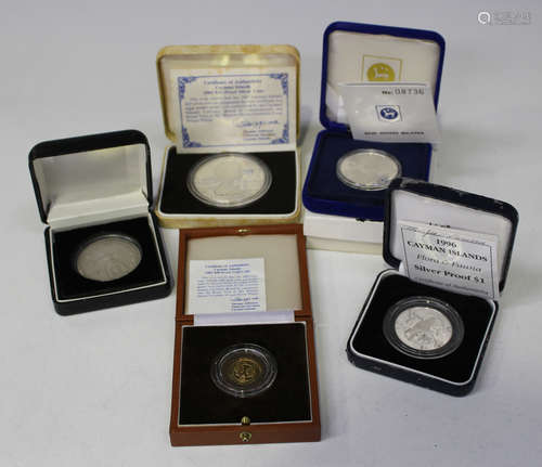 A group of five modern commemorative coins, including a Cayman Islands gold proof fifty dollars 1983