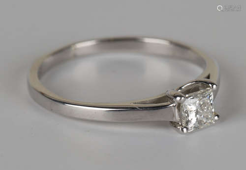 A 9ct white gold and diamond single stone ring, mounted with a princess cut diamond, ring size