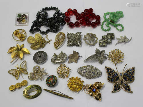 A group of twenty-five brooches, including some silver, marcasite and named examples, including