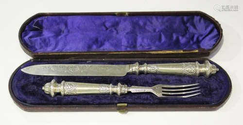 A Victorian silver bread knife and fork with engraved decoration, Sheffield 1870 by Martin Hall &