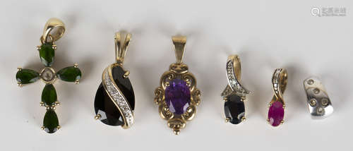 Six 9ct gold and gem set pendants, including a 9ct gold pendant claw set with an oval cut amethyst.