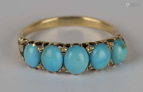 A gold and turquoise five stone ring, mounted with a row of graduated oval turquoise, detailed '