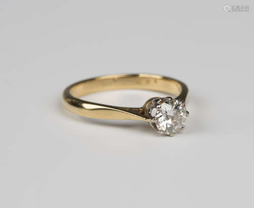 A gold and diamond single stone ring, claw set with a cushion shaped diamond, detailed '18ct',