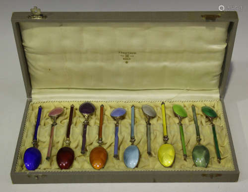 A set of twelve Norwegian sterling and enamelled coffee spoons, each spoon enamelled with a