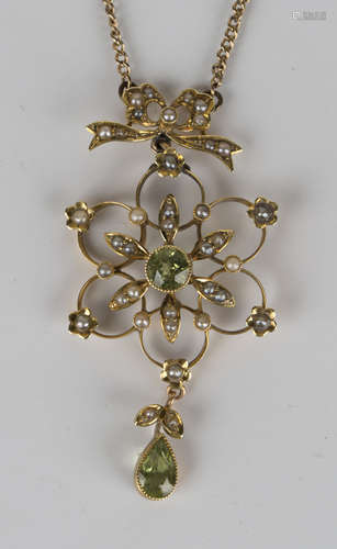 A gold, peridot and seed pearl pendant necklace, in a pierced openwork design, the top with a tied